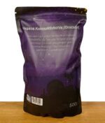 Rückseite der Verpackung der veganen Kokosaktivkohle, mit Informationen zur Reduktion von Schadstoffen im Rauch und Details zur Herkunft.