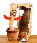 RAW Doobie Dancer mit Verpackung und USB-C Kabel auf Holztisch vor weißem Hintergrund