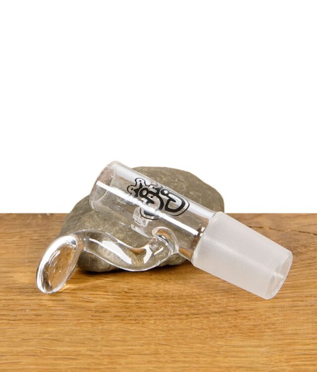 Jelly Joker Glaskopf mit integriertem Sieb und Henkel, liegend auf Naturstein und Holztisch.