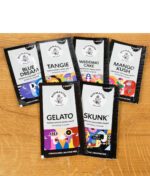 Alle Budmaster Blunts-Sorten als aufgefächerte Packungen auf Holztisch von oben fotografiert