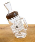 MJ Arsenal Glasaufsatz "Halo" mit Holzring seitlich liegend auf Tisch