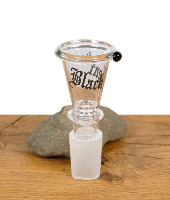 Der Black Leaf Glaskopf ist konisch und mit rollstopp auf Holz präsentiert