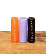 Drei Medusafilters Glasfilter in Sunset, Violet und Schwarz nebeneinander stehend