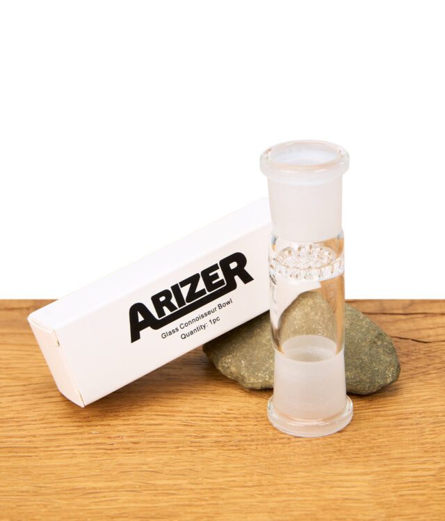 Arizer Kräuterkammer aus Glas, mit Originalverpackung und Steinen auf Holztisch – Zubehör für Arizer und Extreme Q Vaporizer, hochwertiges Ersatzteil.