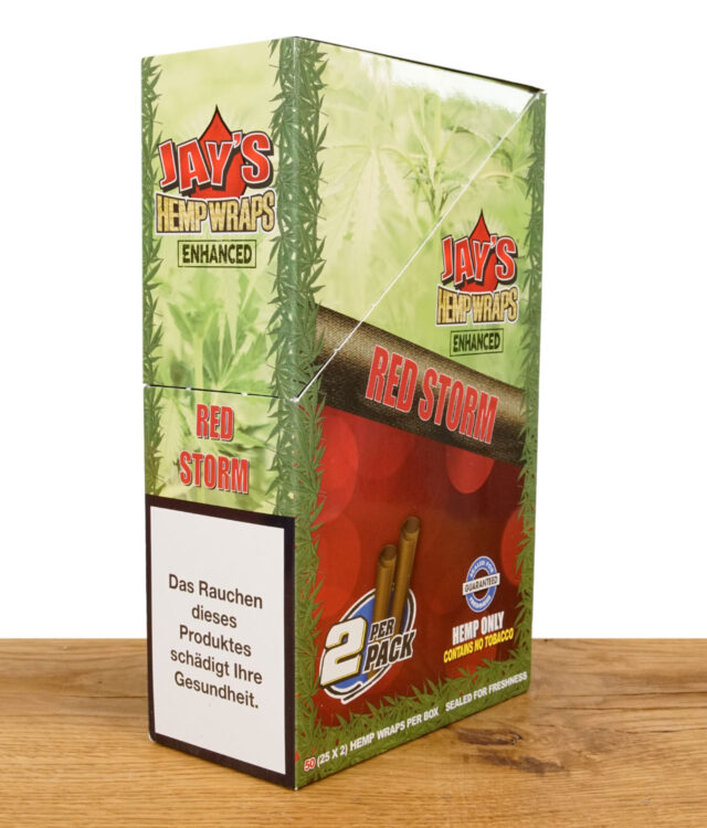 Eine Pappschachtel mit Juicy Hemps Red Storm als Inhalt auf einem Holzbrett