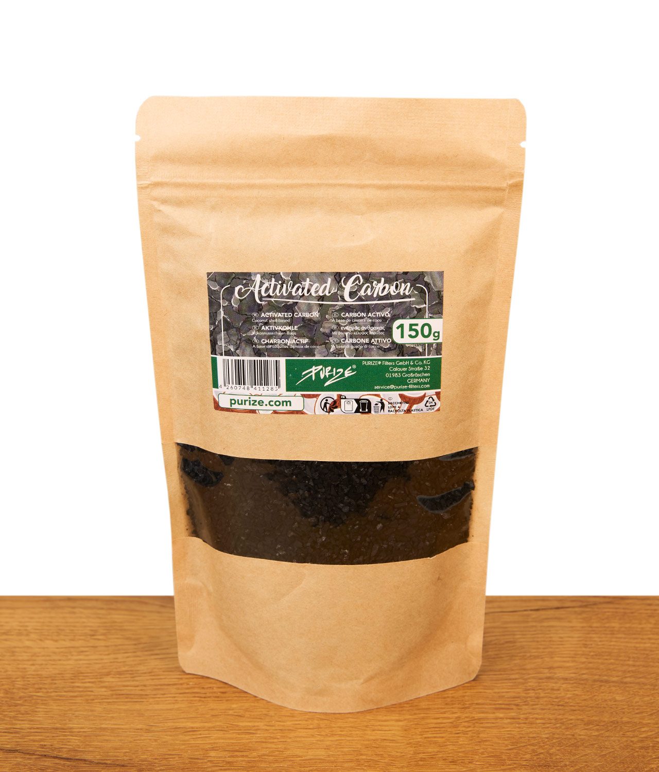 purize-aktivkohle-150-gramm-jpg Beige-farbener Purize Aktivkohle Beutel mit schwarzem Sichtfenster, Etikett mit „Activated Carbon 150g" und Purize-Logo steht auf einer Holzoberfläche vor weißem Hintergrund.