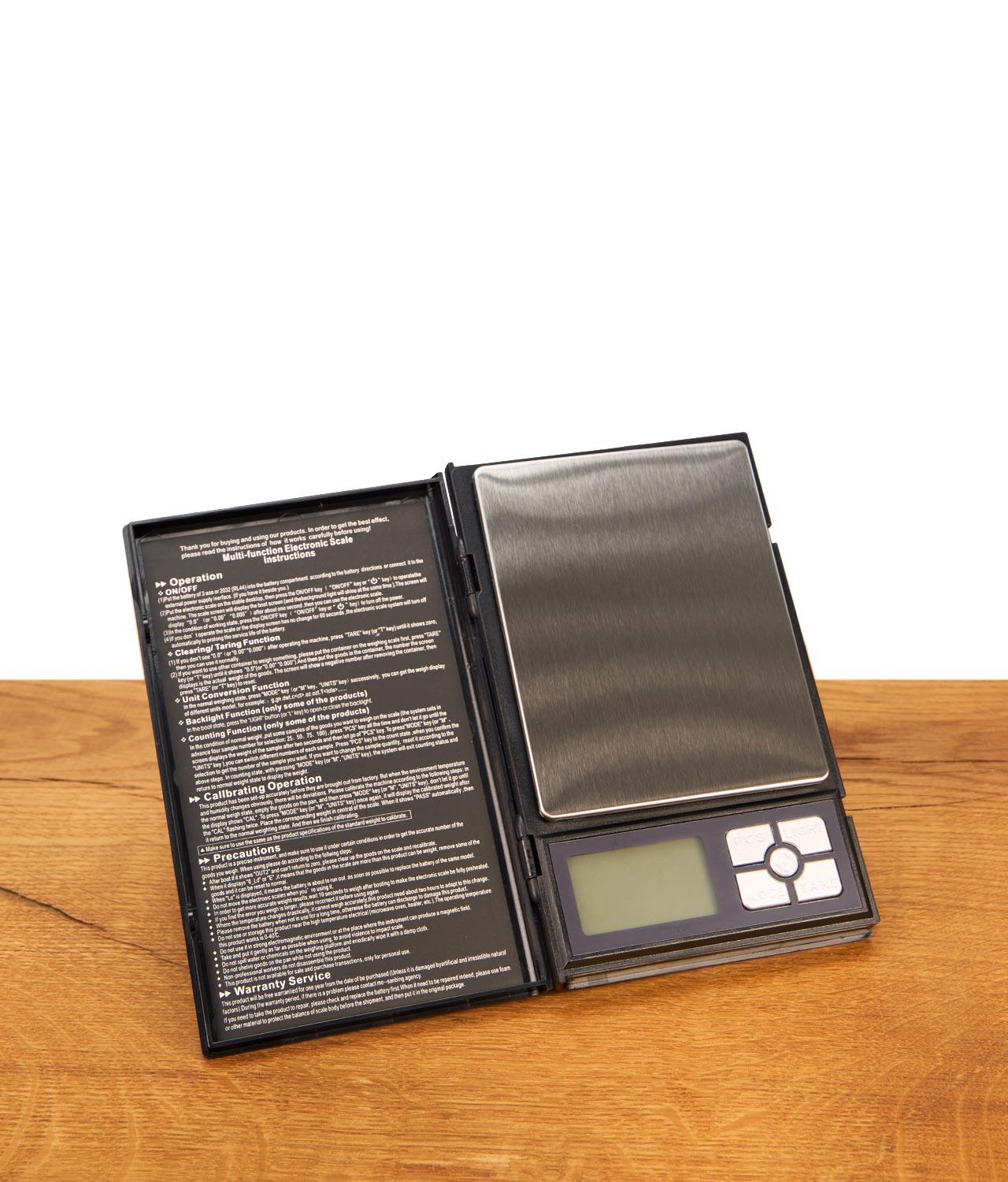 blscale-digitalwaage-bis-500g-notizbuch-jpg Geöffnete BLscale Digitalwaage mit Anleitungen und Funktionstasten