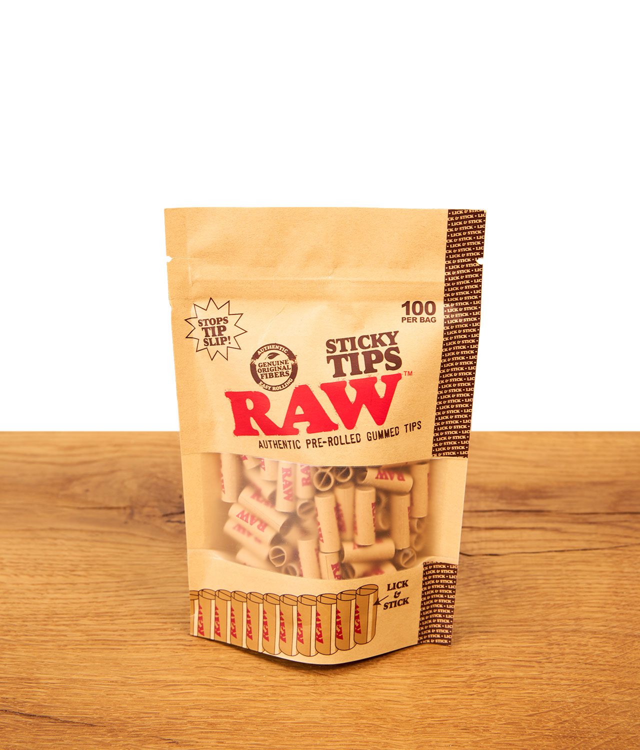 raw-sticky-tips-100er-pack-jpg RAW Sticky Tips 100er Pack: Vorgedrehte, ungebleichte Filtertips mit Klebestreifen im Standbeutel auf Holz.
