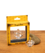 Honeybee Herb Terp Slurper Carb Cap neben der gelben Originalverpackung auf Holz.