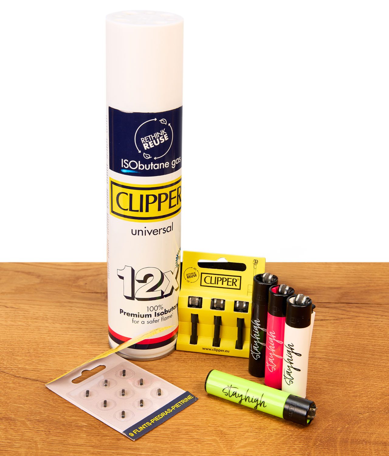 clipper-starter-set-jpg Das Clipper Starter Set von buyhigh mit stayhigh Clippern, Gas, Feuersteinen auf Holz präsentiert.